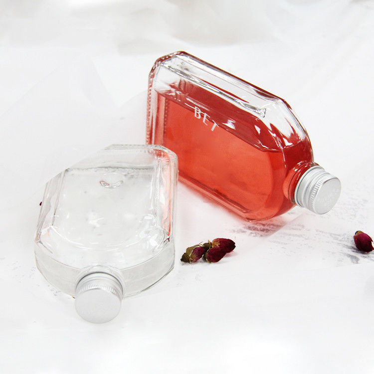 Nouveau design 200ml 250ml 300ml Bouteille en verre transparent à vis