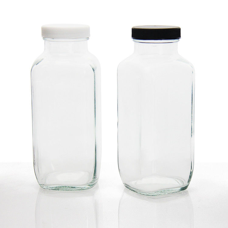 Bouteilles de jus en verre Bouteilles de jus en verre carrées avec un bouchon anti-altération pour l'emballage des boissons au jus