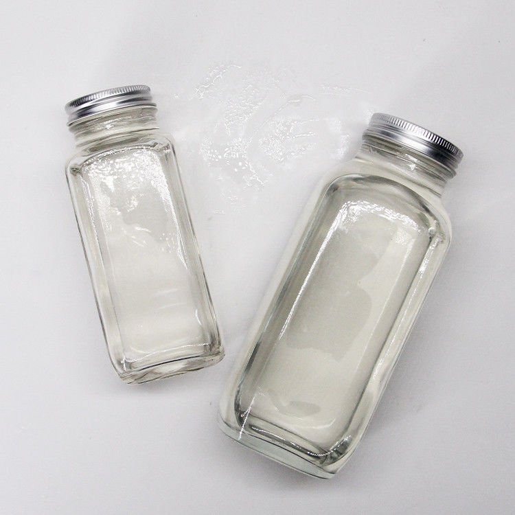 Bouteilles de jus en verre Bouteilles de jus en verre carrées avec un bouchon anti-altération pour l'emballage des boissons au jus