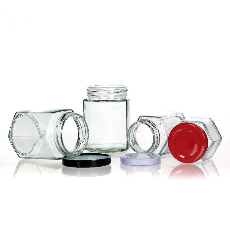 Bouteilles claires avec couvercles Bouteille de verre hexagonale pour le thé