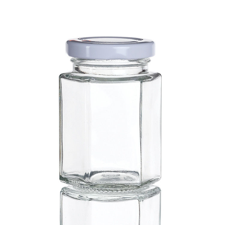 Bouteilles claires avec couvercles Bouteille de verre hexagonale pour le thé